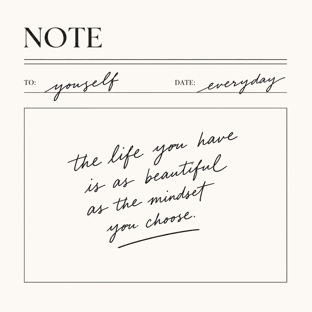 Handwritten note card with motivational quote on cream background