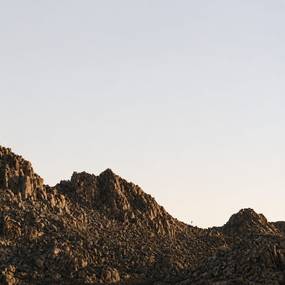 Rocky mountain landscape at dusk with warm earth tones